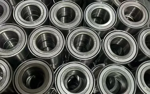 Hundreds of finished CHKZ DAC wheel bearings stacked on the packing line